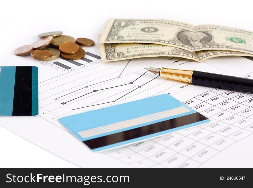 Planning for business. Credit cards, money, and graphics with pen  on white background. Planning for business. Credit cards, money, and graphics with pen  on white background