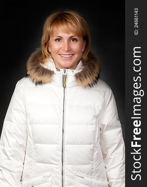 Portrait of a beautiful girl in a winter jacket