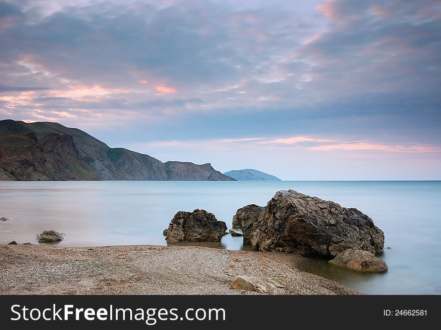 Sea landscape with cape and the cloudy sky. Crimea, Ukraine.