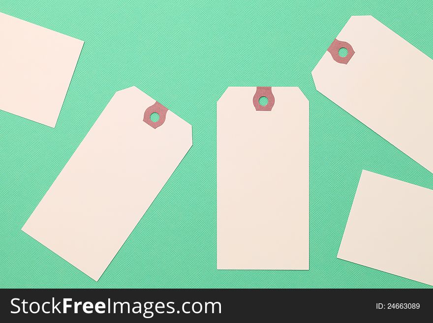 Blank tag on green paper background