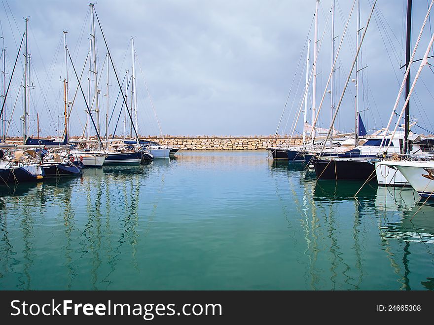 Yachts In The Harbor Standing On An Anchor