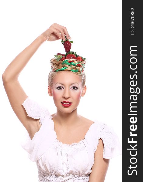Woman with strawberry in her hairstyle over white background