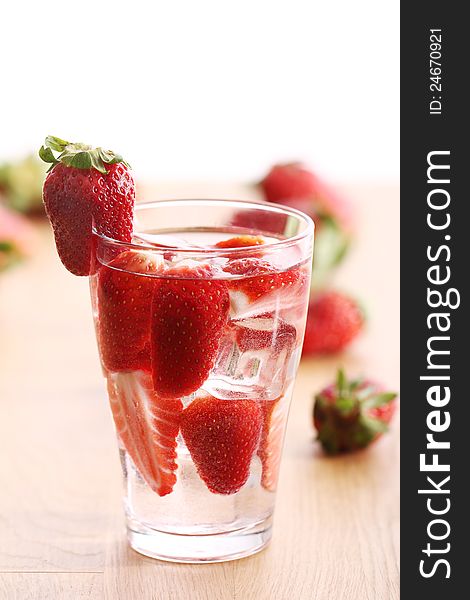Glass of cold drink with strawberries