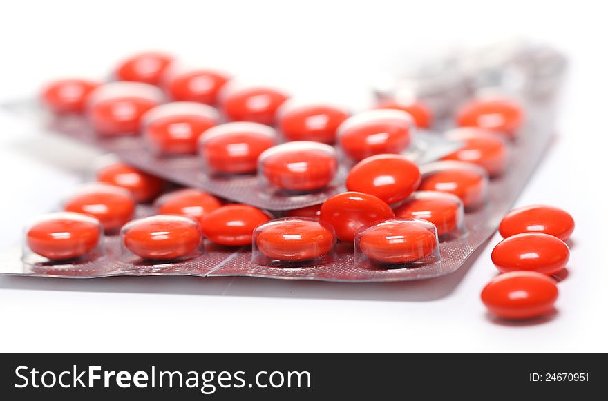 Close up of pills over white background