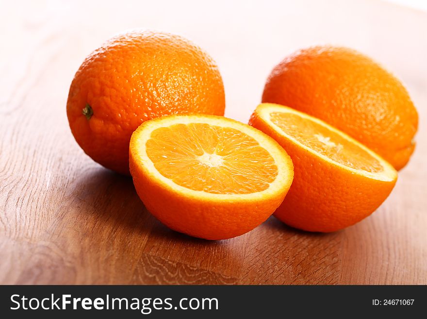 Close up of fresh oranges on wooden board