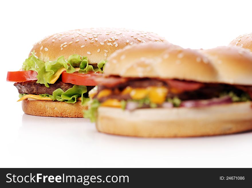 Big and tasty burgers over white background