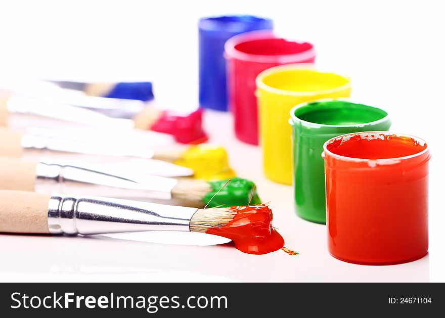 Close up of cans with colorful paint