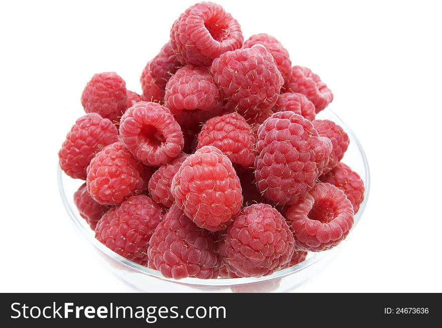 Raspberry on white background in the restaurant. Raspberry on white background in the restaurant