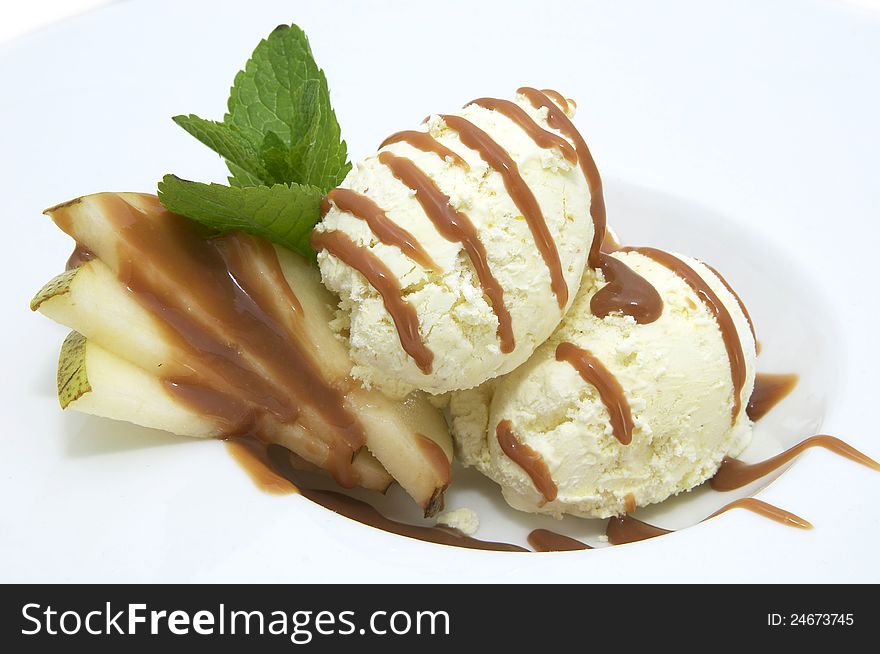 Ice cream with caramel sauce and mint on a white background