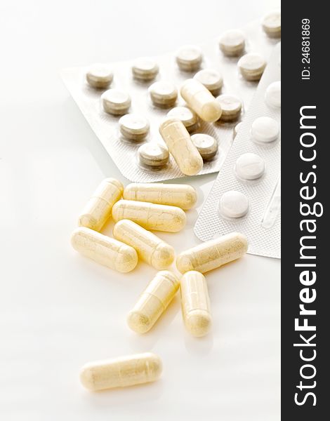 Pills and capsules  on a white background