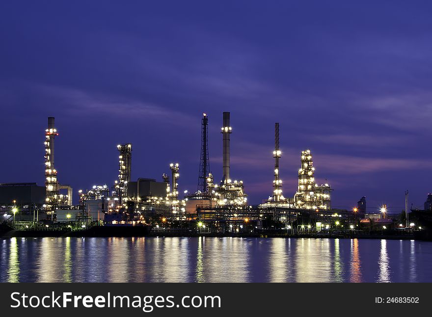 Oil refinery glowing in the twilight. Oil refinery glowing in the twilight