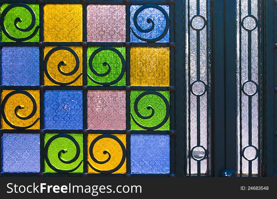 Bright and colorful texture from stain glass door