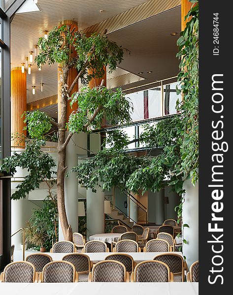 Foyer of a luxury hotel with pillars and greenery. Foyer of a luxury hotel with pillars and greenery