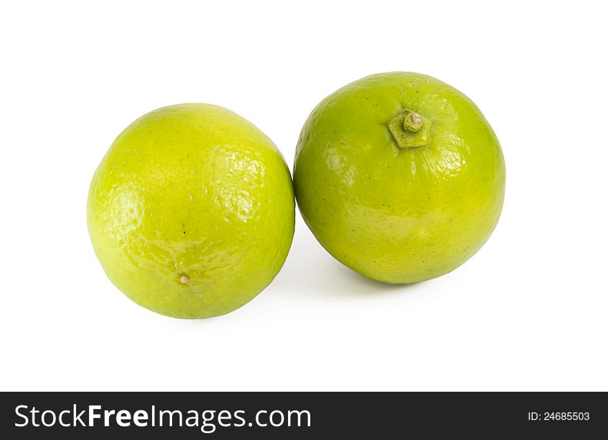 Two green lime isolated on white background