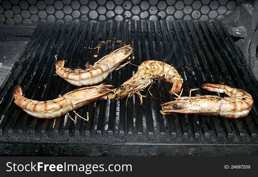 Cooking shrimp on the grill in the restaurant. Cooking shrimp on the grill in the restaurant