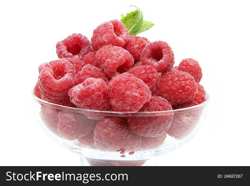 Raspberry on white background in the restaurant. Raspberry on white background in the restaurant