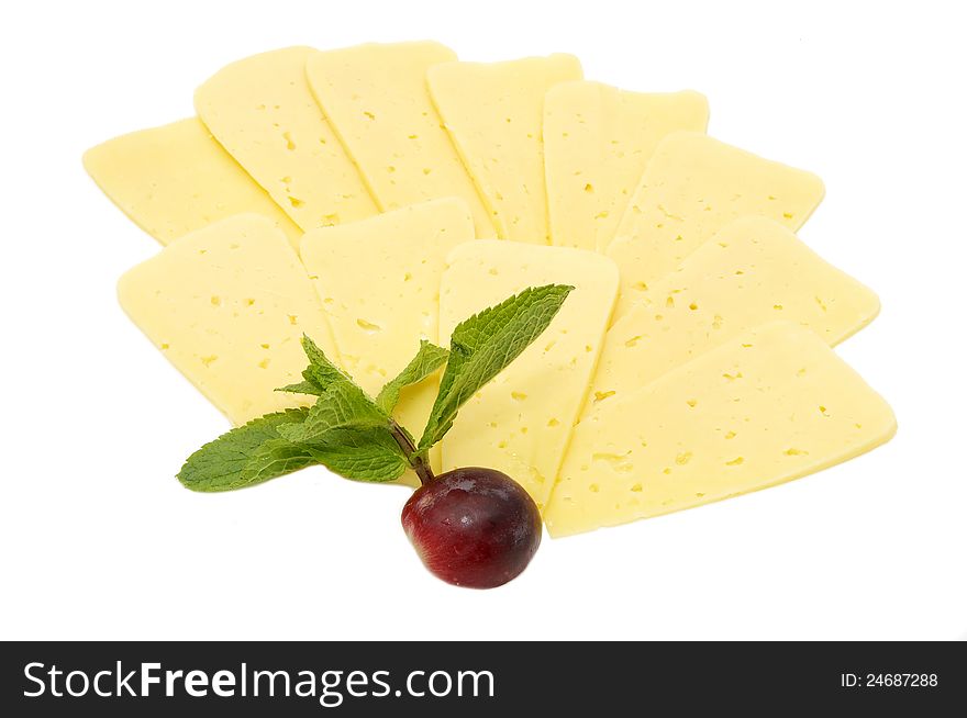 Cheese on a white background decorated with radish and mint