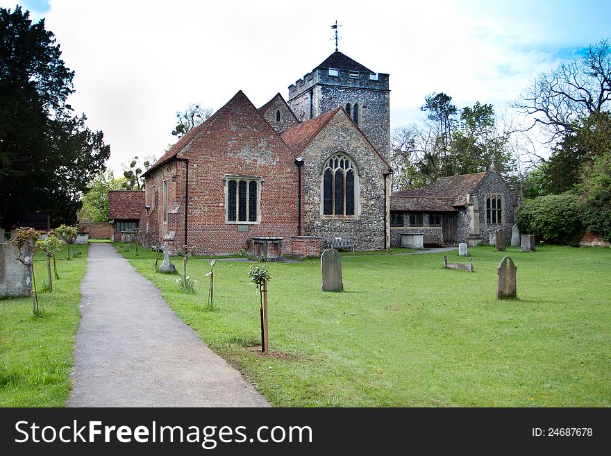 Parish church of St Giles in Stoke Poges England which is the setting for Thomas Grays famous poem Elegy in a Churchyard. Photo shows Thomas Grays tombstone next to a plaque on the church wall which records this as his burial place in 1771. Grays Elegy is one of the most famous poems in the English language and records his grief at the death of his mother who is also buried in the churchyard. Parish church of St Giles in Stoke Poges England which is the setting for Thomas Grays famous poem Elegy in a Churchyard. Photo shows Thomas Grays tombstone next to a plaque on the church wall which records this as his burial place in 1771. Grays Elegy is one of the most famous poems in the English language and records his grief at the death of his mother who is also buried in the churchyard.