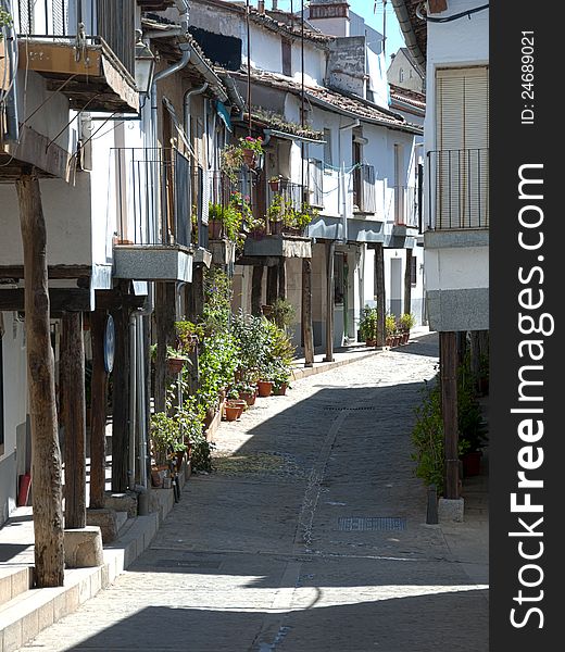 Narrow empty street in Guadalupe, Spain