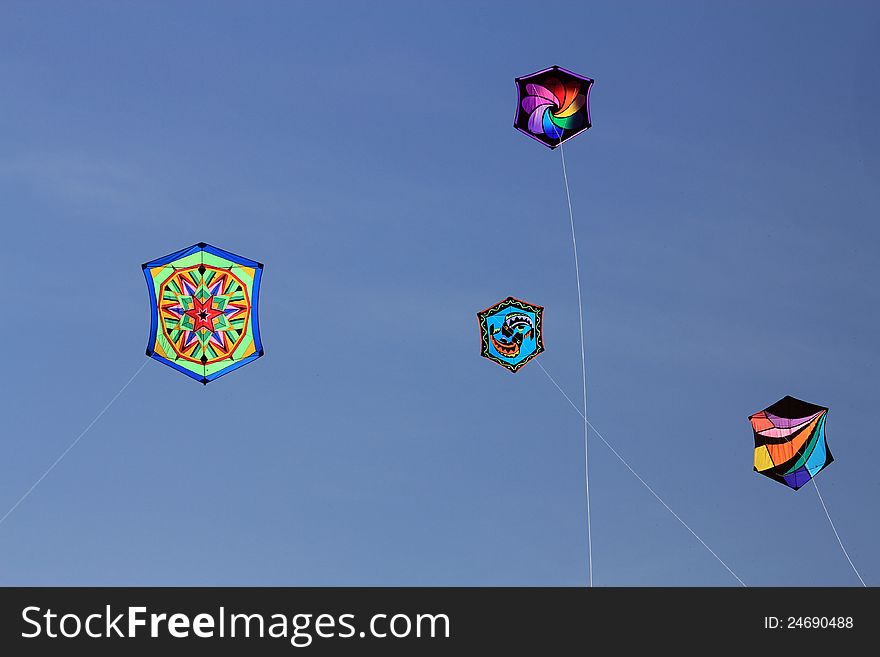 Four colorful  kites flying in the sky. Four colorful  kites flying in the sky