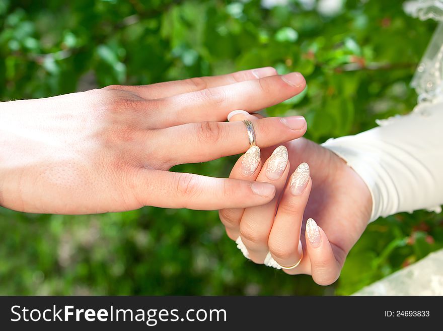 Hands of the groom and the bride with rings. Hands of the groom and the bride with rings
