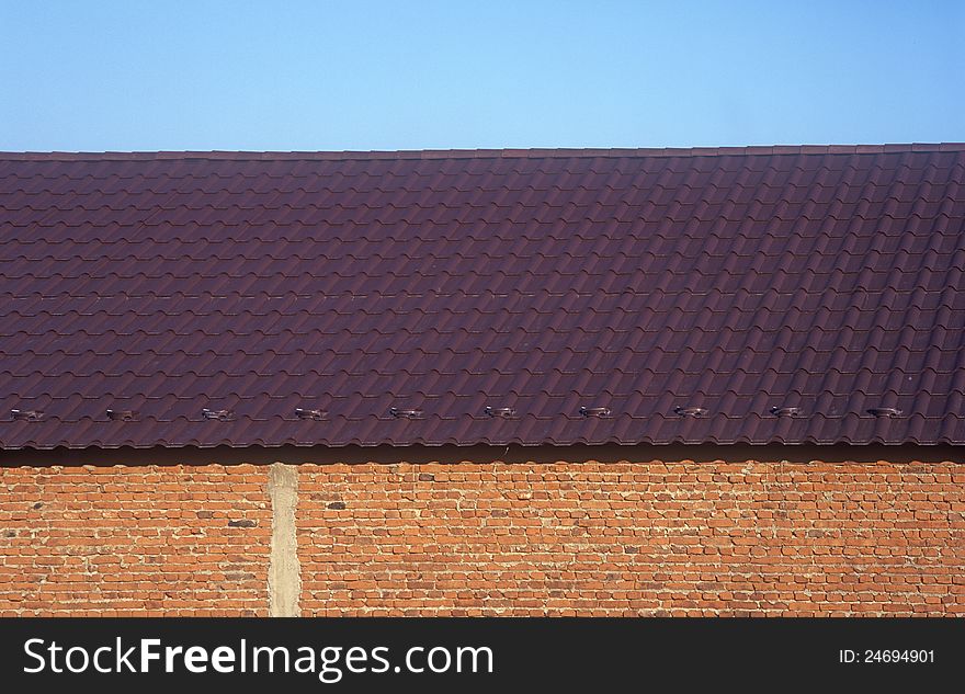 Wall, roof and blue sky at sunny day. Wall, roof and blue sky at sunny day.