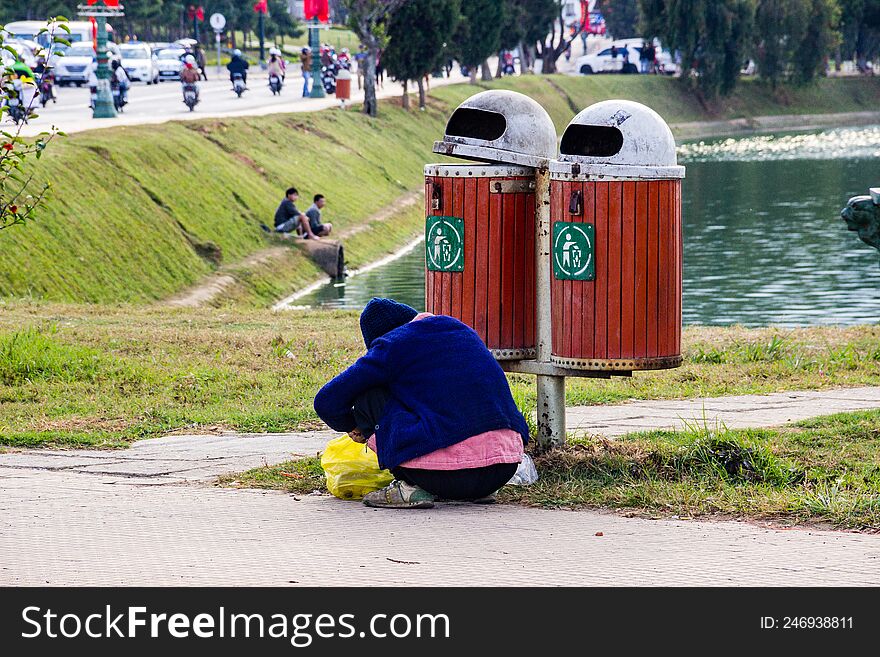 old man collects bottles in the city