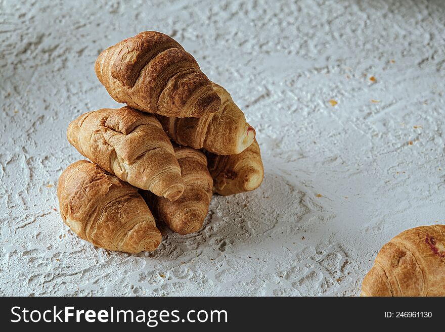 croissants with chocolate on a light background