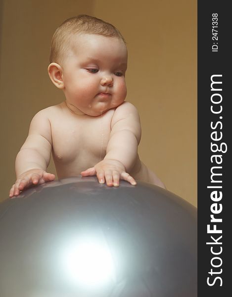 An image of a baby on the big ball. An image of a baby on the big ball