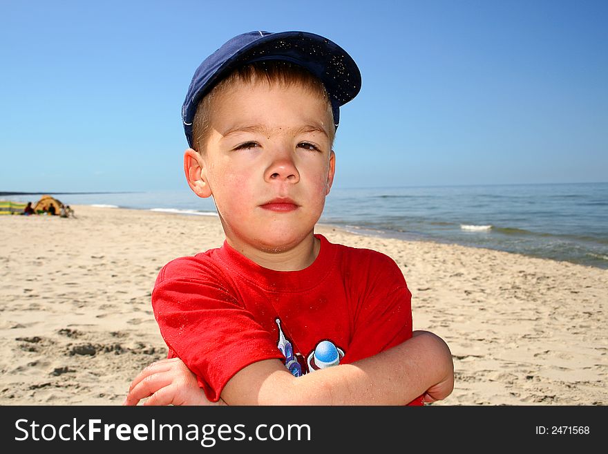 A Little Boy On The Beach