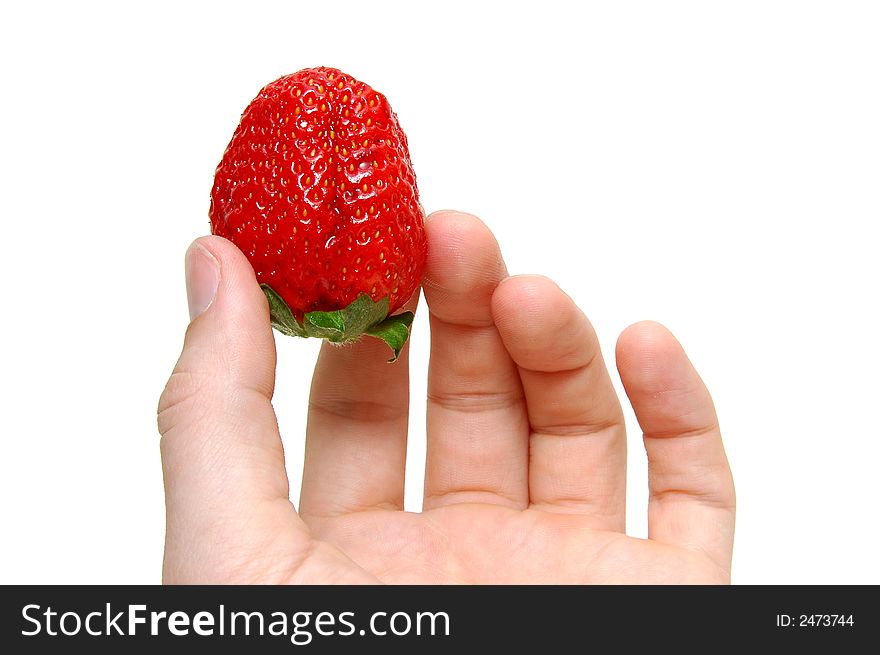 Strawberry in a hand on a white background