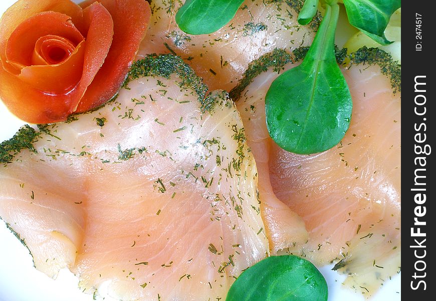 Salmon marinated with dill, rose made of tomato