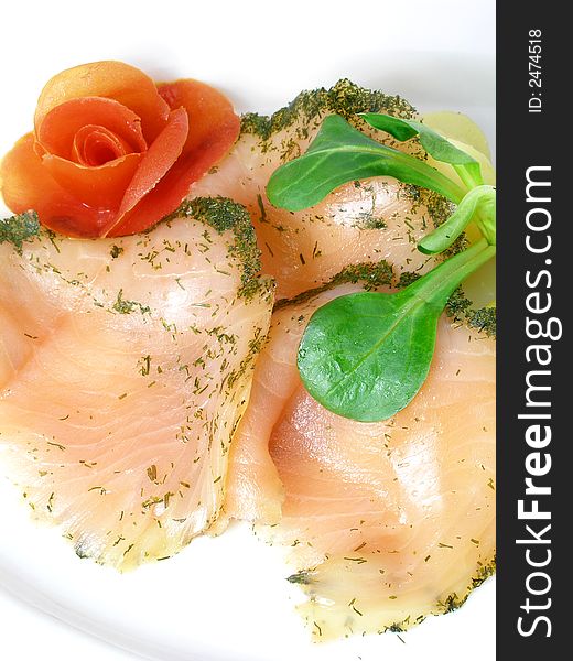 Salmon marinated with dill, rose made of tomato. Salmon marinated with dill, rose made of tomato