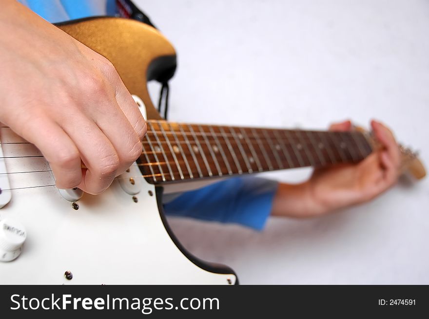 Guitar playing detail on white background