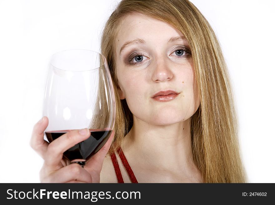 Beautiful girl holding a glass of wine - focus on face. Beautiful girl holding a glass of wine - focus on face
