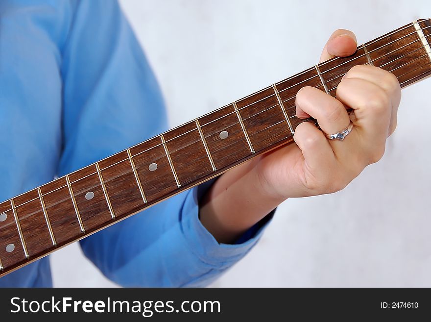 Detail of woman playing the guitar. Detail of woman playing the guitar