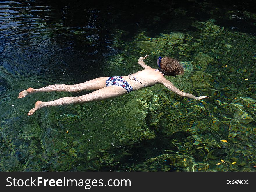 Women snorkeling in a tide pool