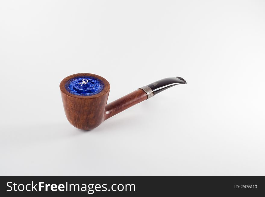 A tobacco pipe with a some of water. A tobacco pipe with a some of water