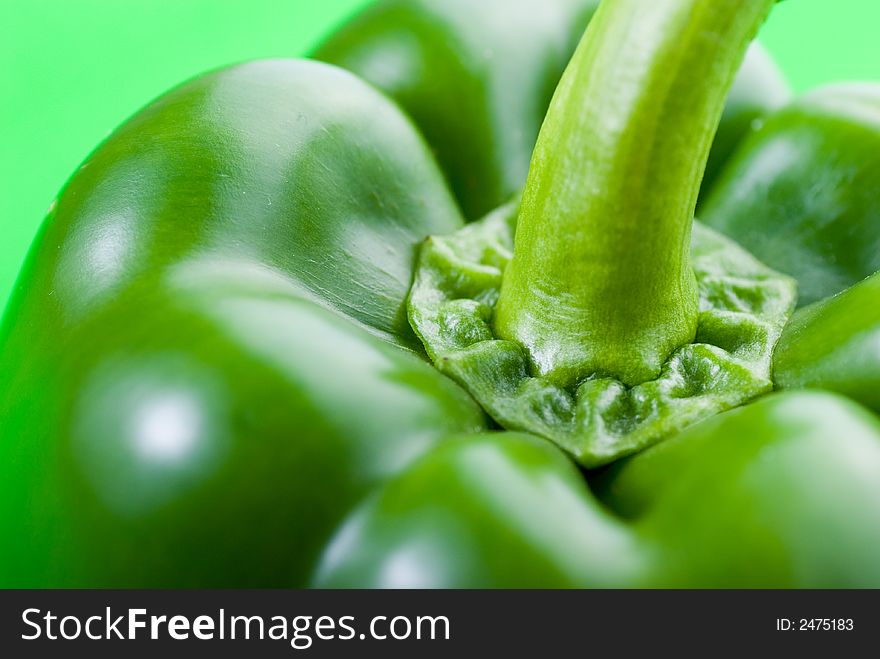 Green pepper on green background