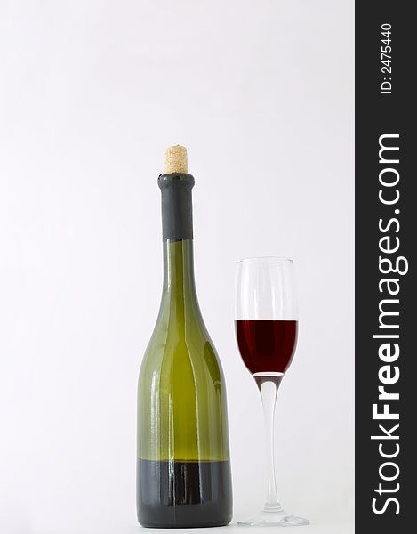 Red dessert wine in bottle and in wineglass