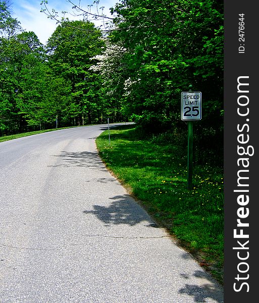 Picture of the oad with the speed sign. Picture of the oad with the speed sign