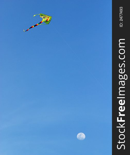 Colorful kite and moons in the skies