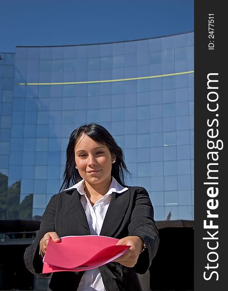 Businesswoman downtown holding a file