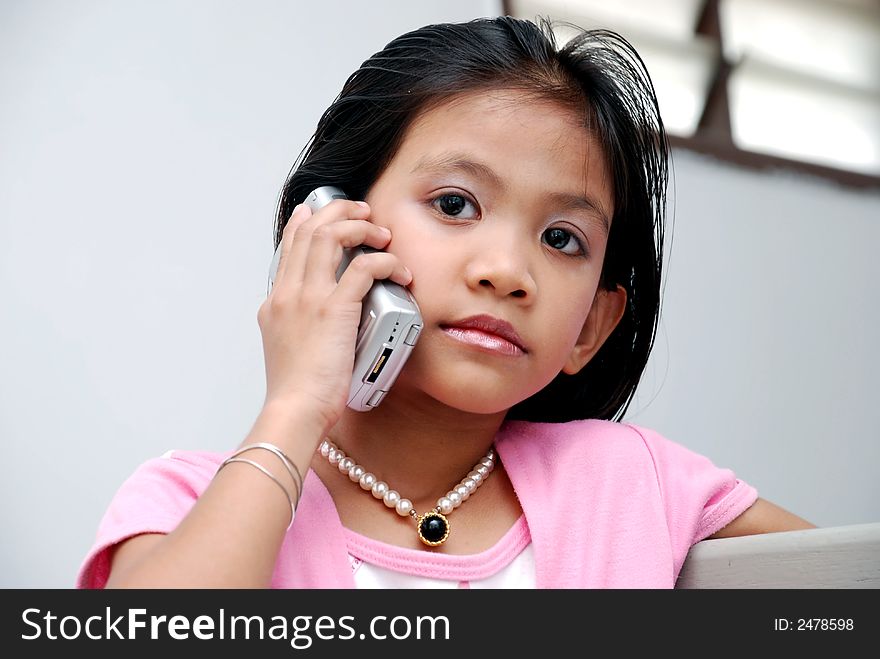 Cute child white handphone on the white background. Cute child white handphone on the white background