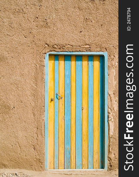 Colored door in the desert, Morocco