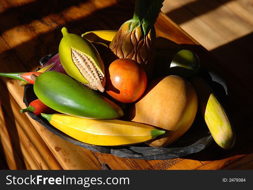 Still life of wooden carved fruit in bowl. Still life of wooden carved fruit in bowl