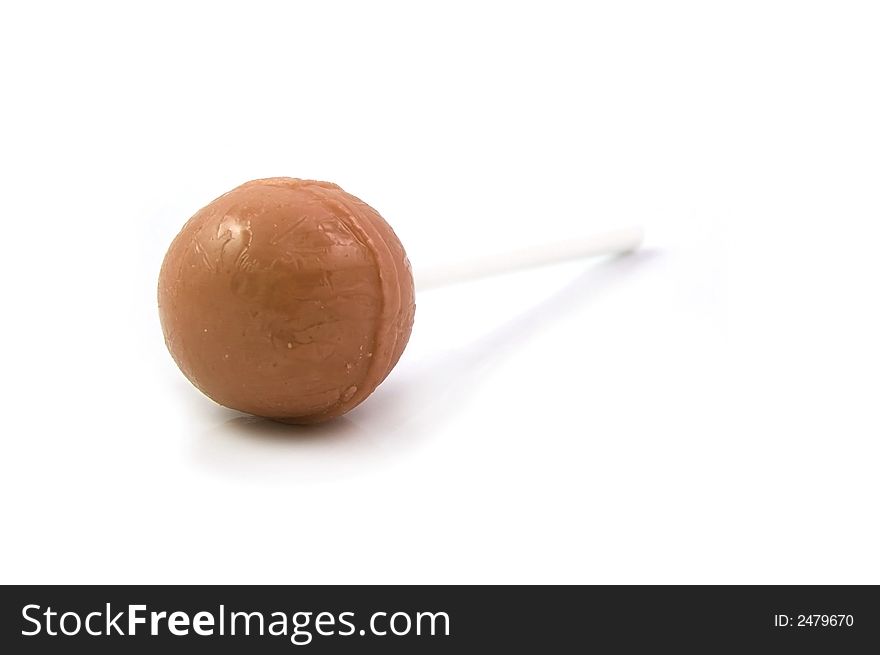 Orange Candy Lollipop on a white stick
