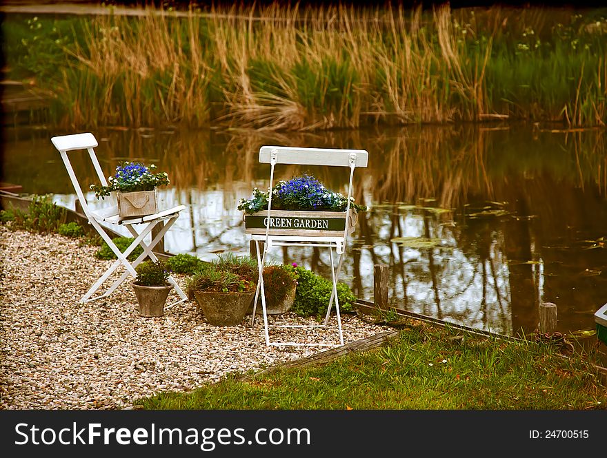 Traditional garden in retro style by river. Traditional garden in retro style by river