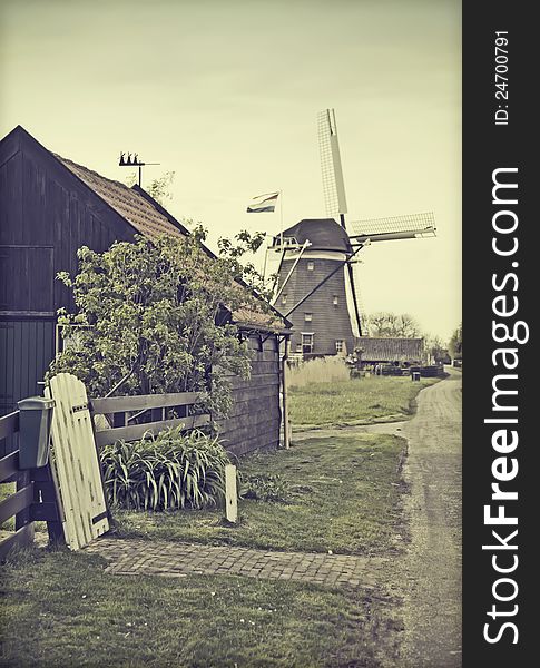 Retro stylish photo of old dutch country-side with windmill. Retro stylish photo of old dutch country-side with windmill