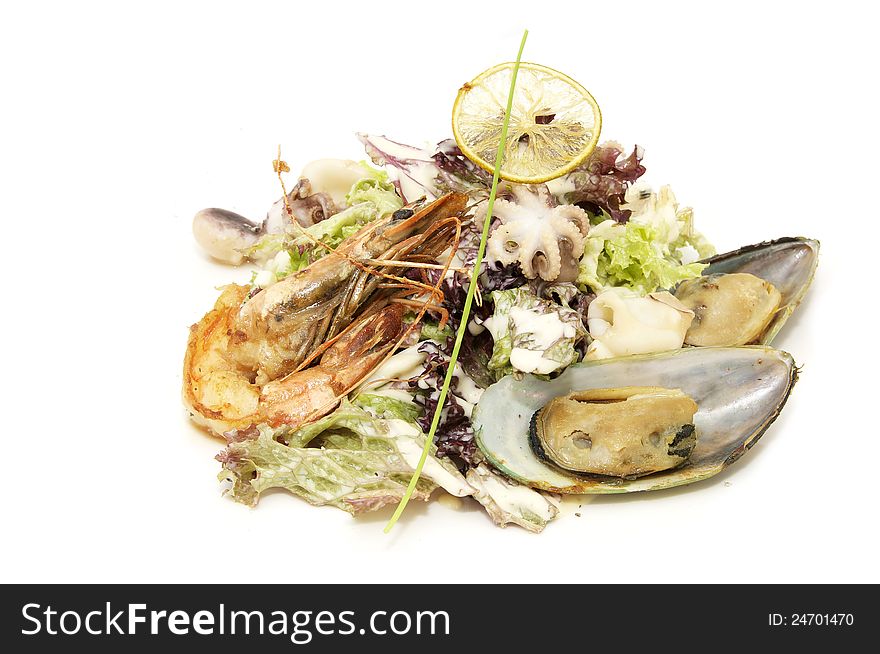 Seafood salad on a plate on a white background